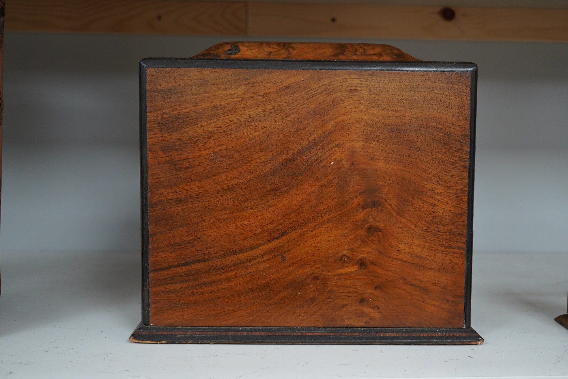 A Victorian burr walnut workbox, with blue silk semi-circular sewing drawer. 29cm wide, 26cm high. Condition - fair